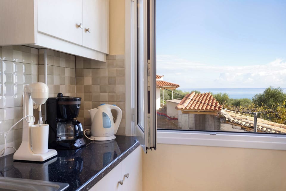 Kitchen counter with coffee machine and window with natural light