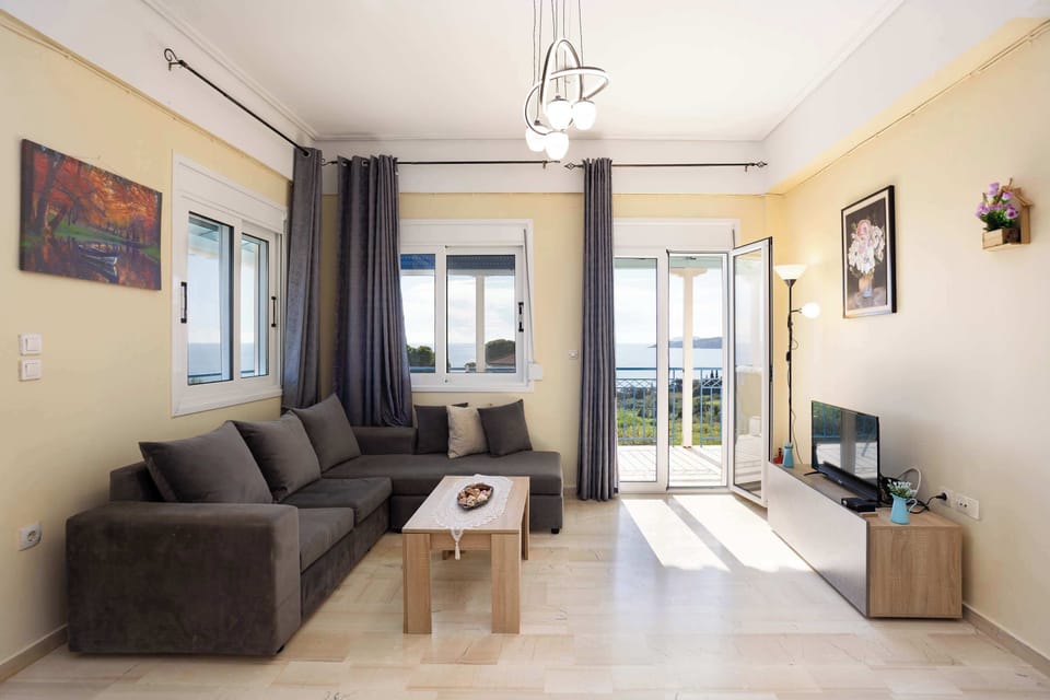 Bright living room with comfortable sofa and balcony access