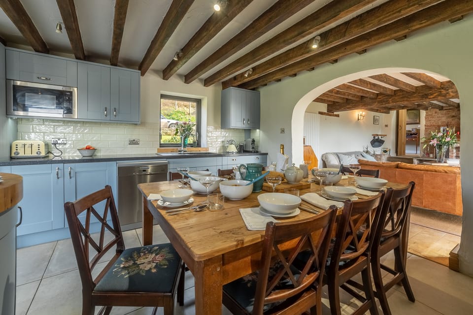 Ground floor: Dining area with archway leading to sitting room