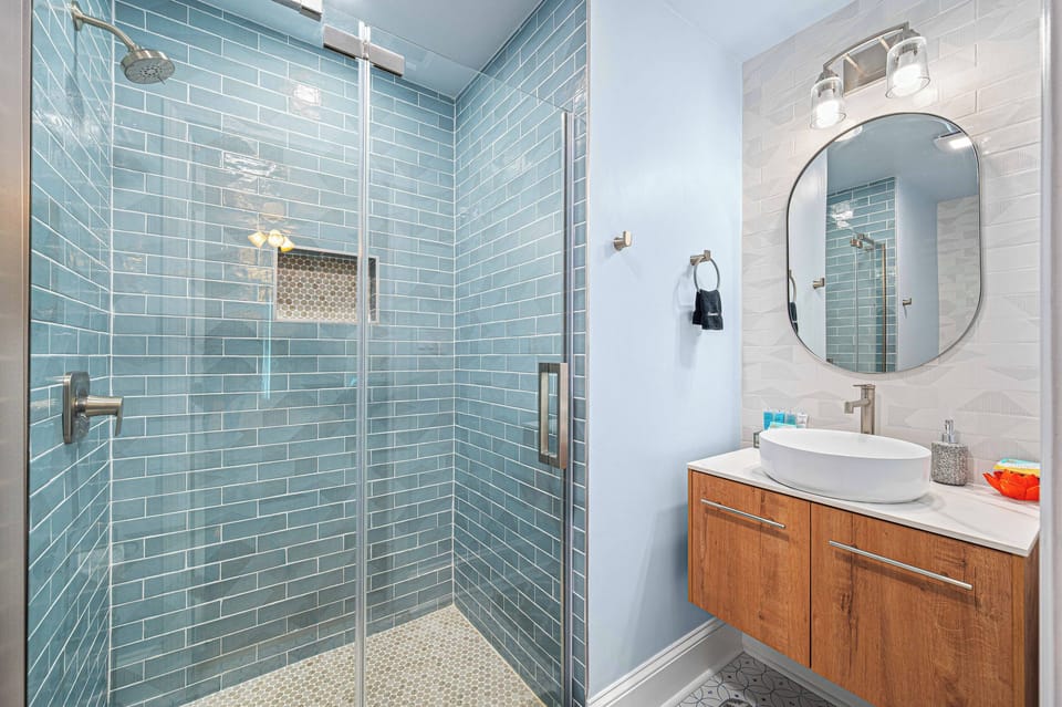 Walk in shower and vanity in the private en suite downstairs.  No sharing sink space with the kids!