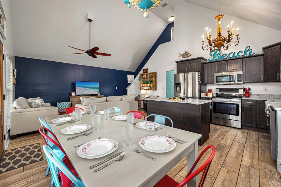 Set the table for a real sit-down meal — plates, glasses, everything already here in our fully stocked kitchen.