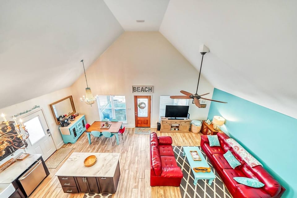 Ascend to beachy bliss with our open-concept living space! 🏠✨ Enjoy panoramic views from above as you step into a world of coastal charm and comfort. 🌊🌴