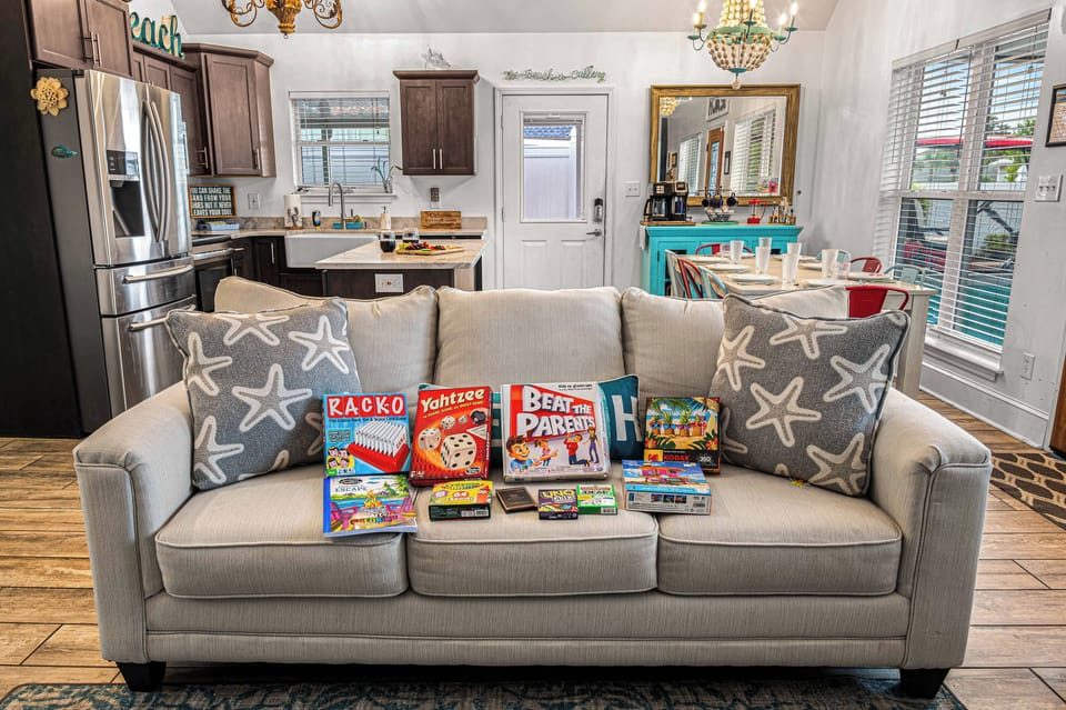 The entire lower level living area is one big open space, keeping everyone connected.  Check the cabinet to access our board game supply!