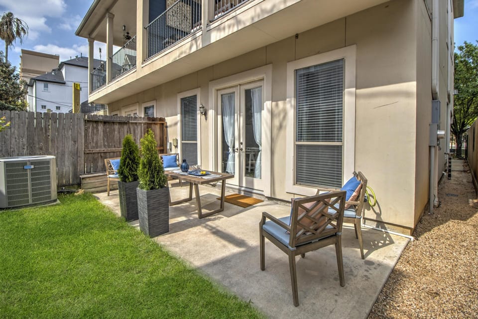 Downstairs patio with grass area for play or sunbathing