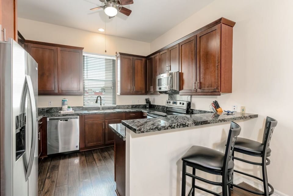 Our kitchen bar seats 2 and is perfect for an afternoon snack after a morning by our South Padre Island swimming pool.