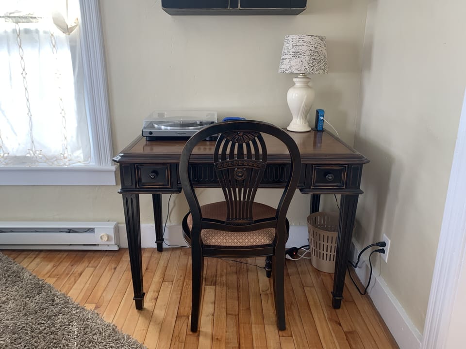 In the quiet sitting room is a desk and record player - and plenty of records!