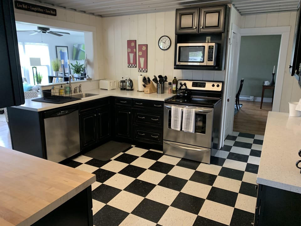 Well-stocked kitchen open to breakfast area and living room