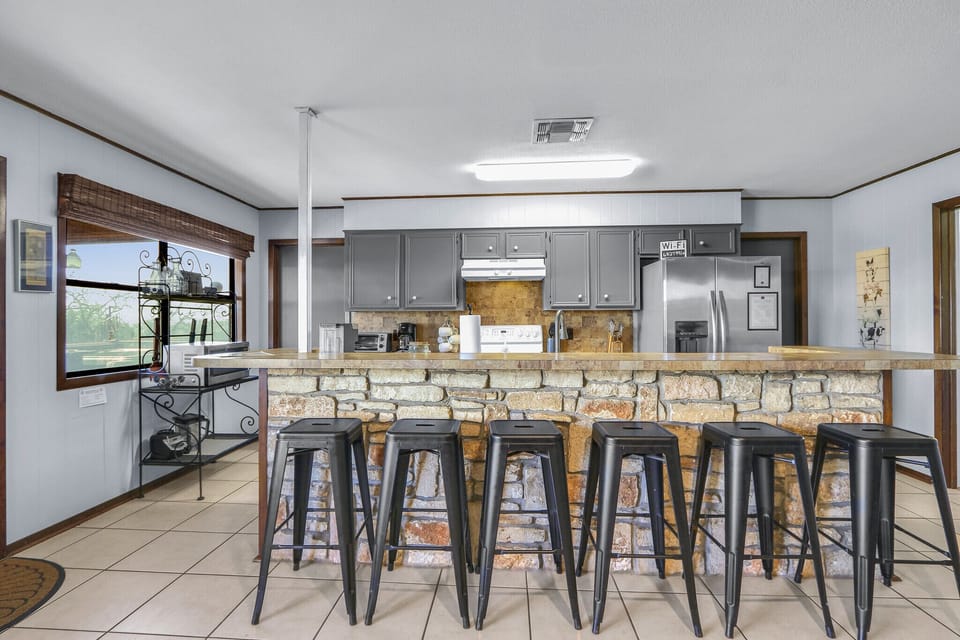 The kitchen is adjacent to the dining room