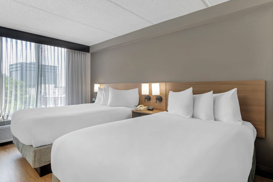 Premium bedding, down comforters, desk, laptop workspace