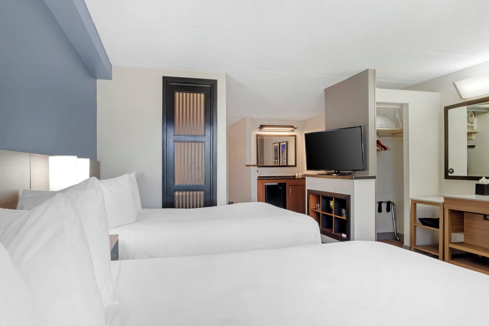 Premium bedding, down comforters, desk, laptop workspace