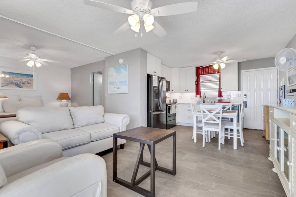The updated kitchen is well equipped with upgraded appliances, including a refrigerator/freezer, stove, microwave and dishwasher.
