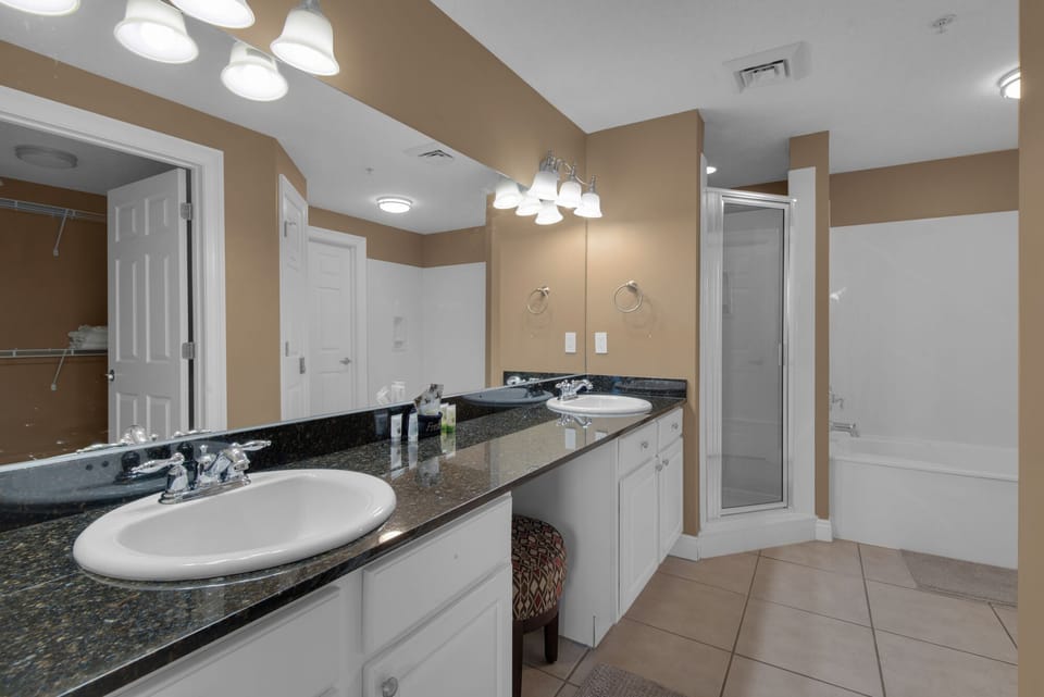 Primary Bathroom - Primary bath has a separate shower and garden tub, with dual sinks.