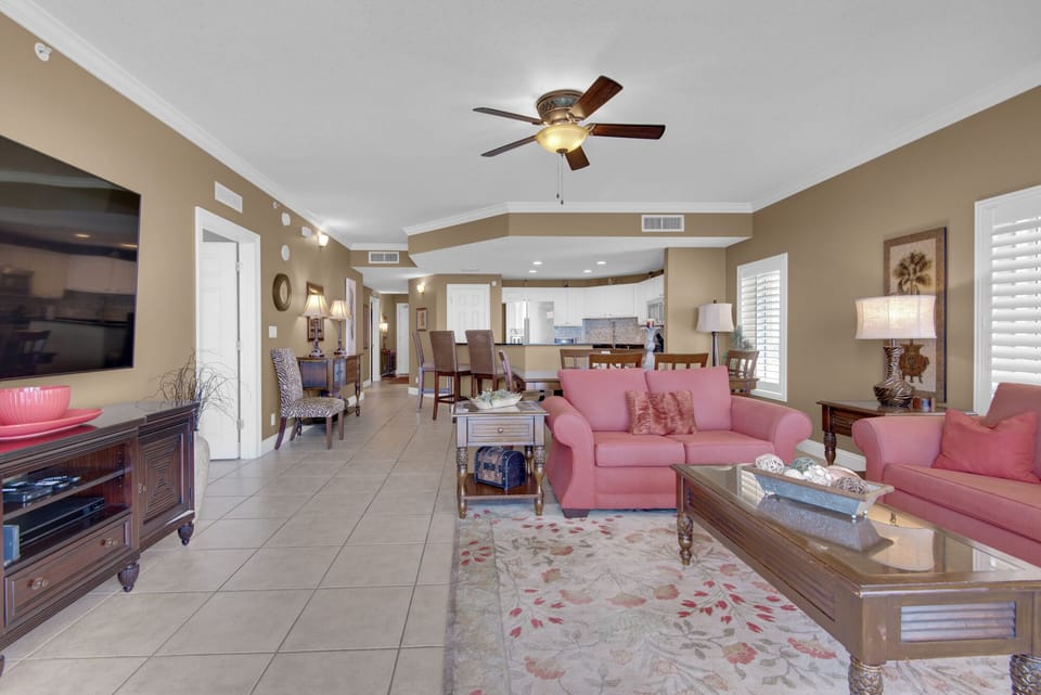 Living Room - This luxurious beachfront living room offers ultimate comfort, a spacious layout, a large flat-screen TV, and endless ocean views for the perfect retreat.
