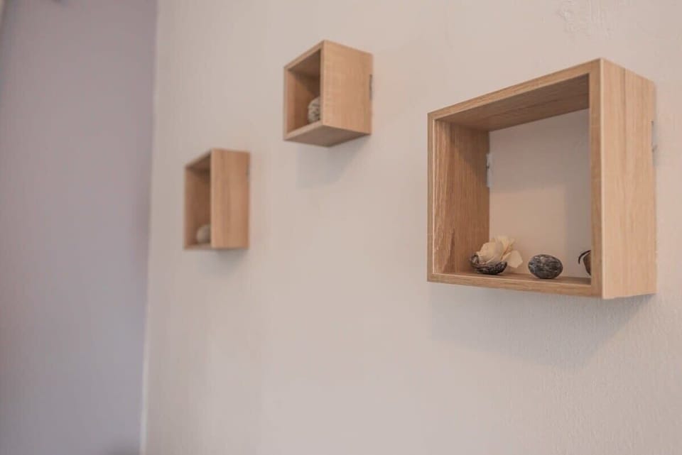 Design Details – Smart wall shelving and minimalist accents elevate the space.