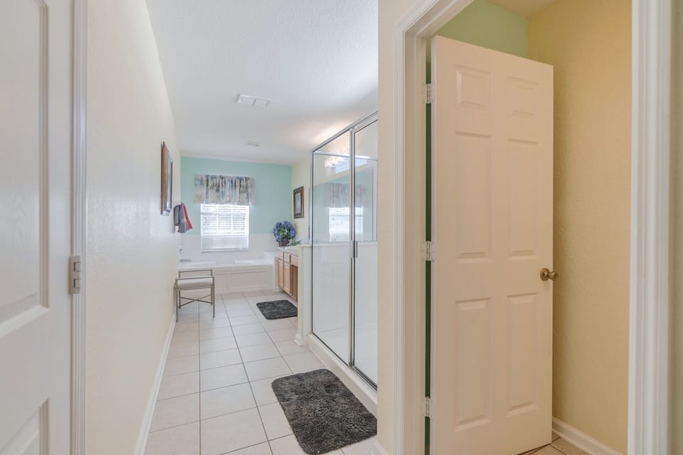 Master Bathroom with Garden Tub and Tile Shower with Glass Surround.