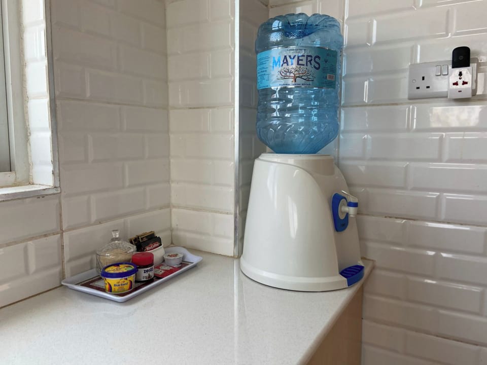 Executive Apartment, 1 Bedroom, Non Smoking, Balcony | Private kitchen | Electric kettle, dining tables