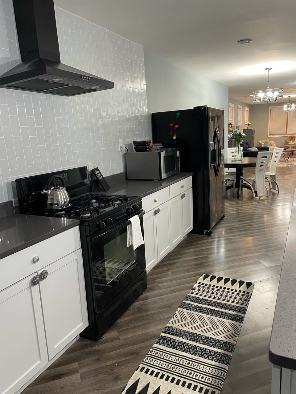 Side by side refrigerator/freezer with in door water and ice dispenser 