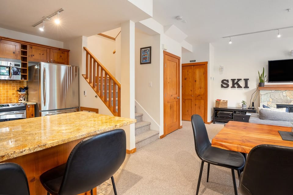 The open-concept layout flows effortlessly from kitchen to dining.