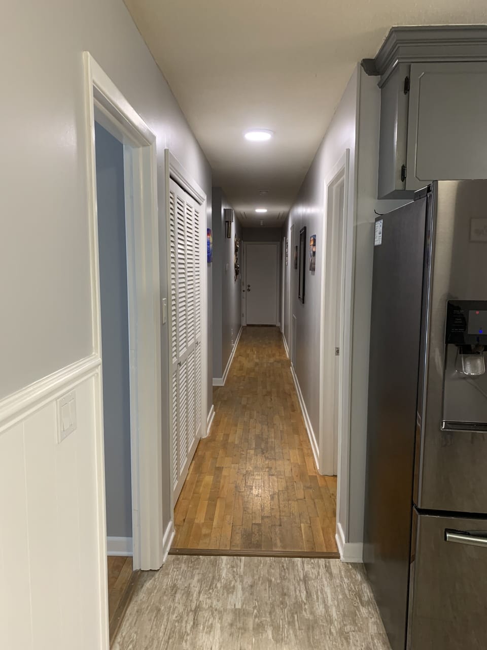 Kitchen looking down hall to last bedroom 