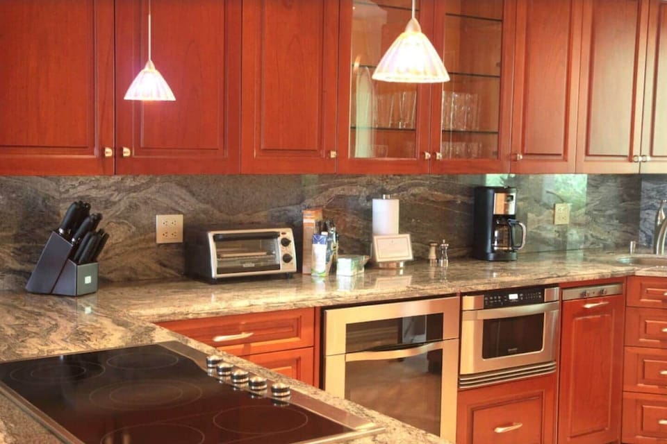 The kitchen, pachote wood and gorgeous granite in this well stocked kitchen.  
