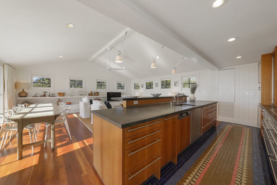ADJACENT OPEN KITCHEN, DINING, AND SECOND LIVING AREA