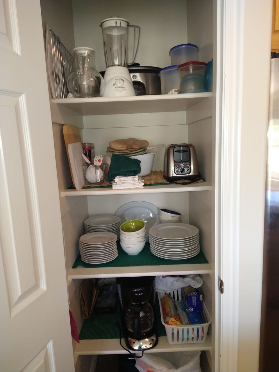 Plenty of dishes, crock pot, blender, coffee maker, toaster & smokeless grill.
