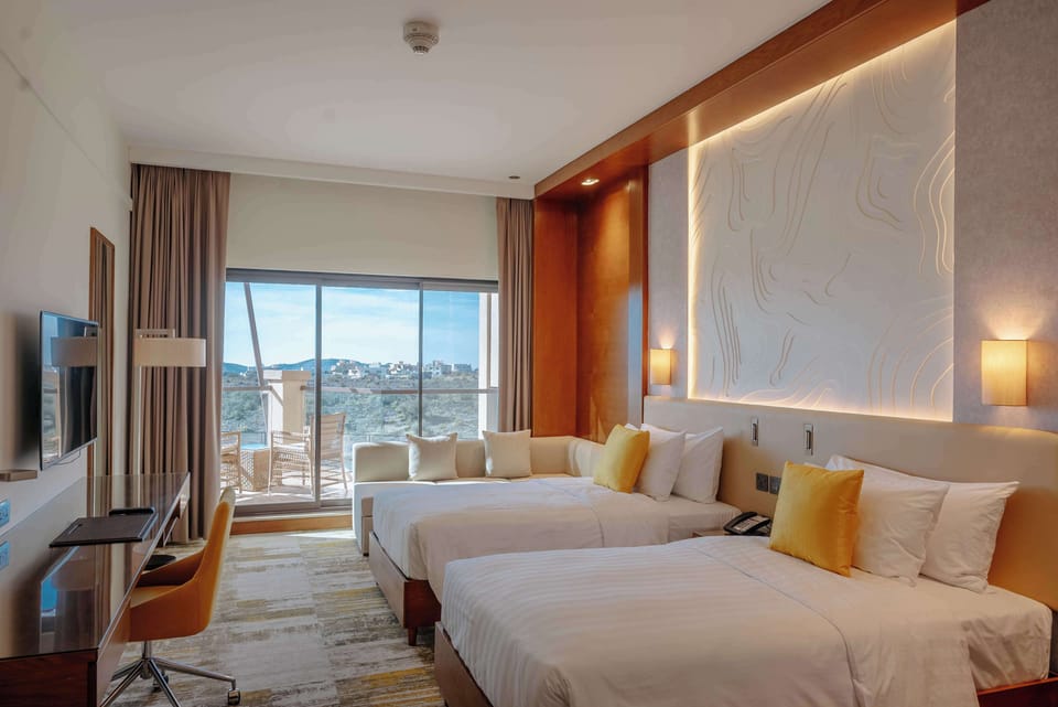 Premium bedding, memory foam beds, minibar, in-room safe