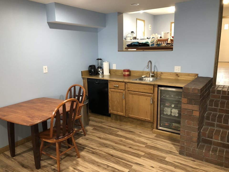 Wet bar, beverage cooler, and additional dishwasher for convenience. 