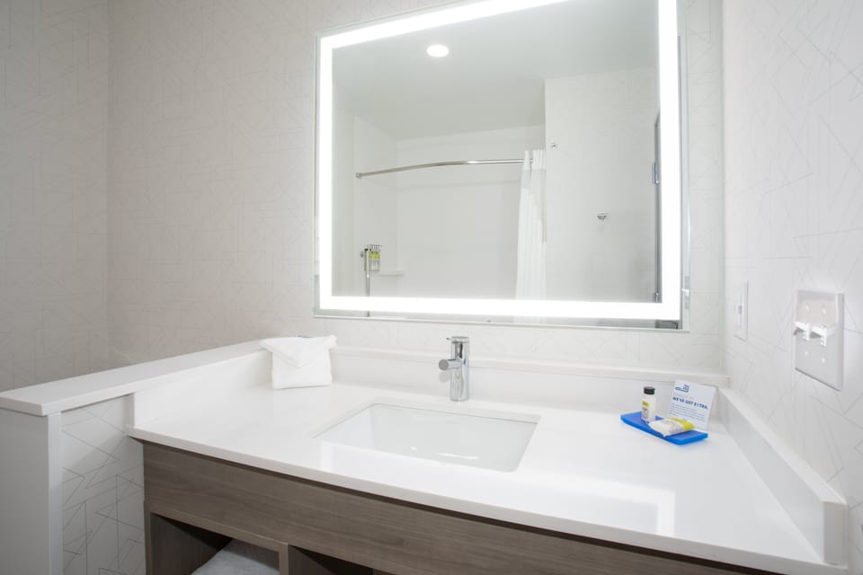 Combined shower/tub, hair dryer, towels, soap