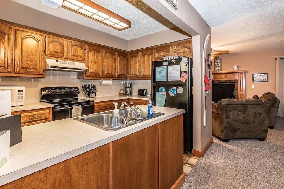Kitchen with dishwasher and basic cooking supplies