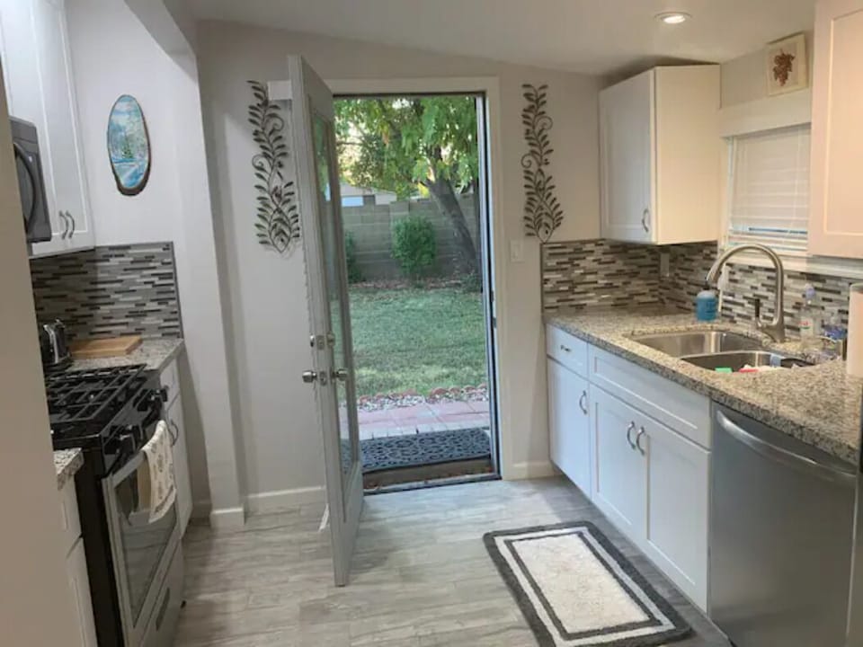 Kitchen opens to backyard
