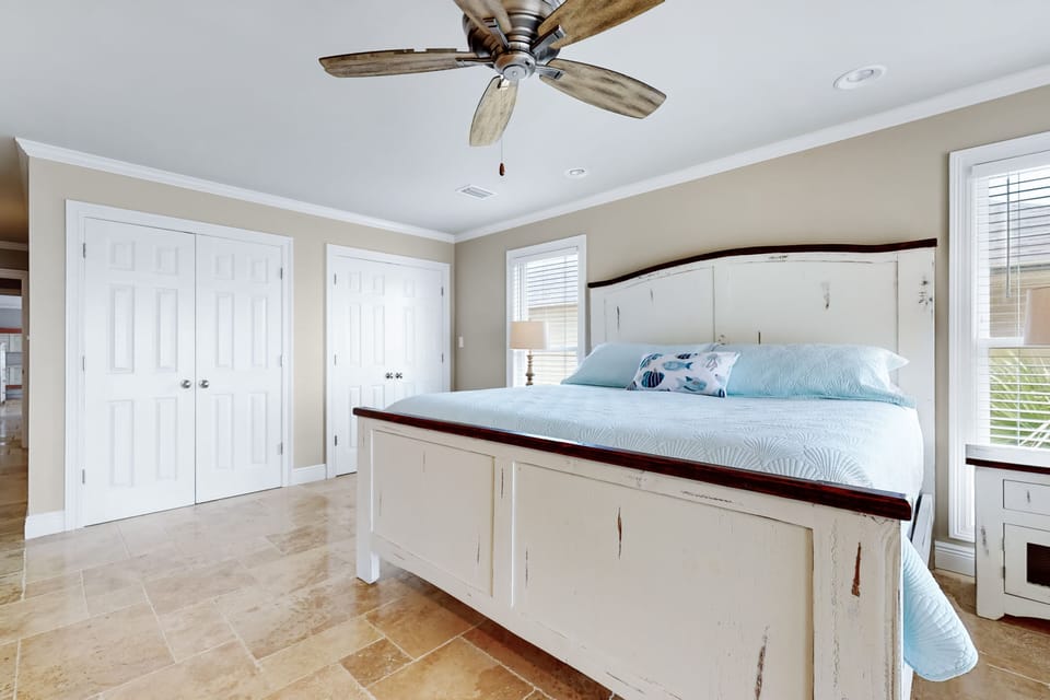 Master bedroom on 2nd floor with king bed and balcony with views on the gulf. 