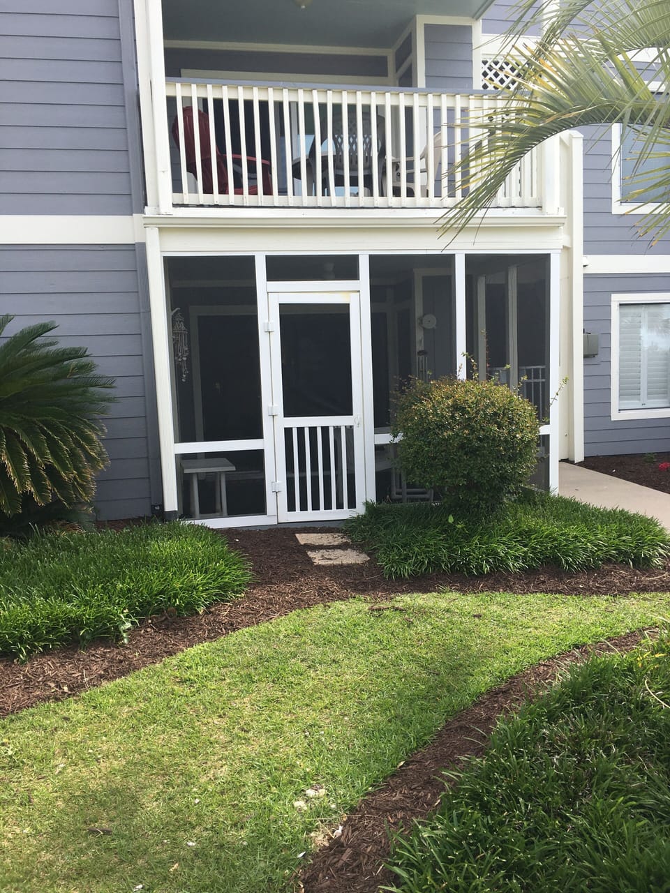 Screened in porch just steps away from the pool.