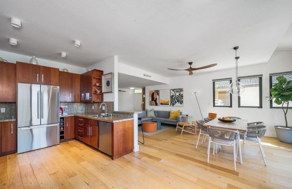 Spacious kitchen with Bosch fridge, dishwasher and hardwood floors