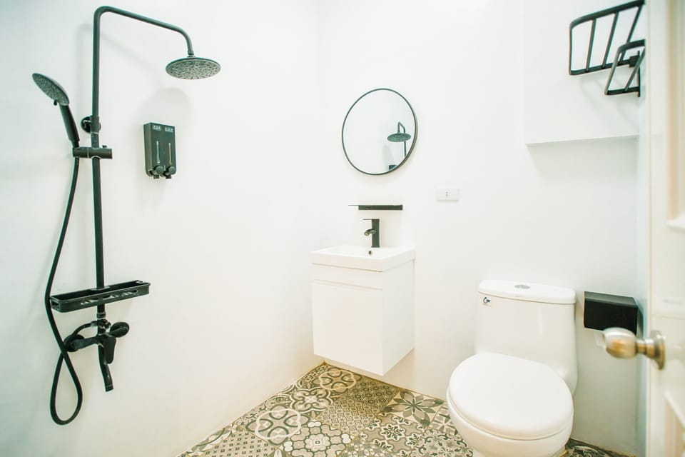 Shower, hair dryer, slippers, towels