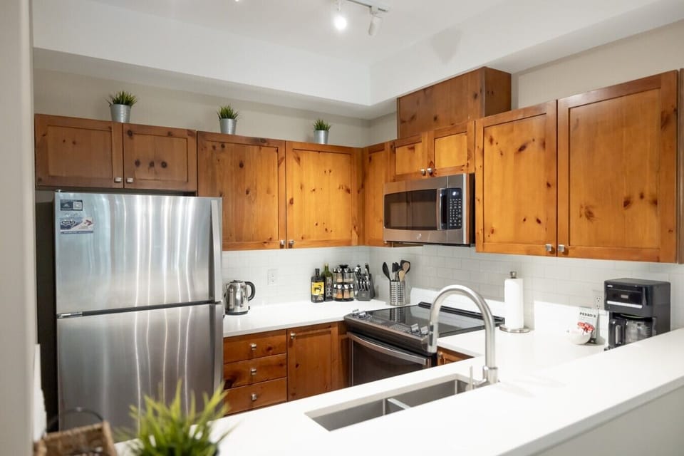Modern, fully equipped kitchen with everything you need to prepare meals, from quick breakfasts to family dinners. `A great apartment, exactly as described with very well equipped kitchen.` - Andrew