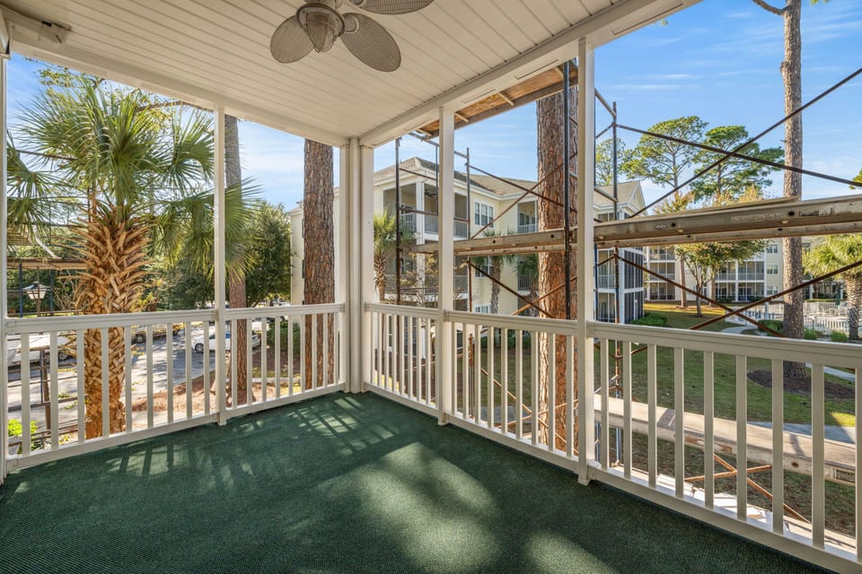 Relax with your favorite cocktail on the screened porch.