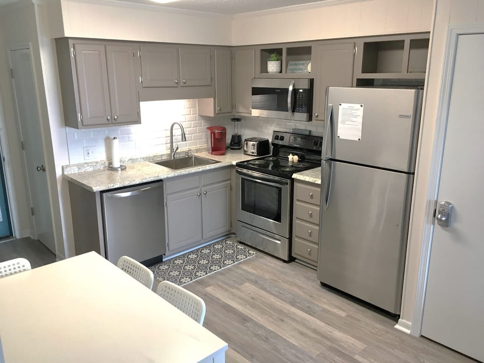 Kitchen with new appliances (2021). Pantry storage in closet behind sink.