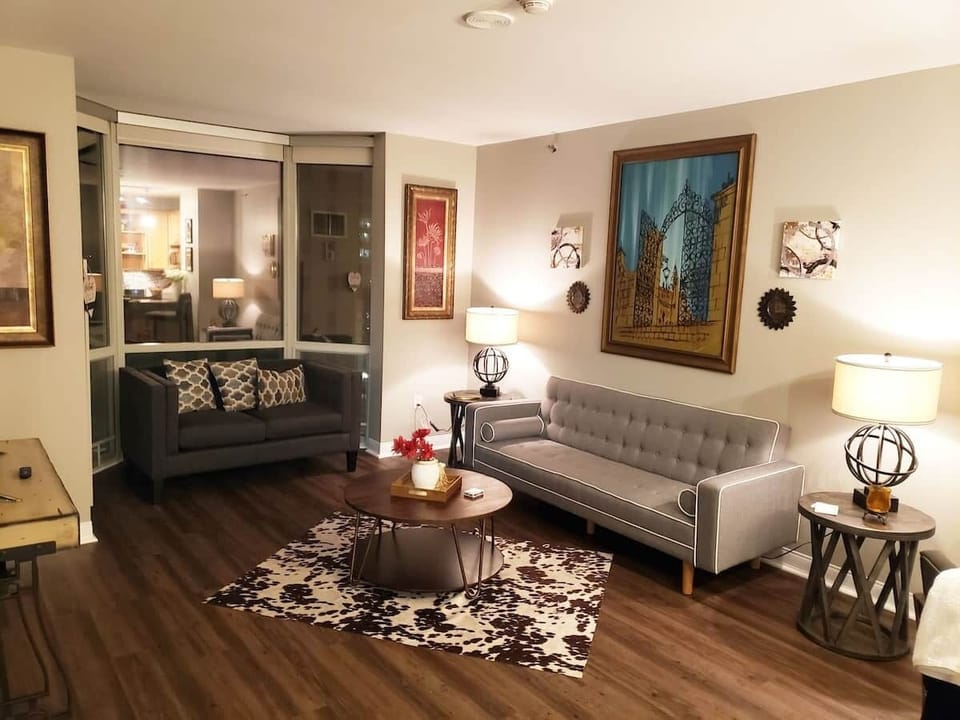 Living room of apartment offers comfort & a sleeper sofa. 