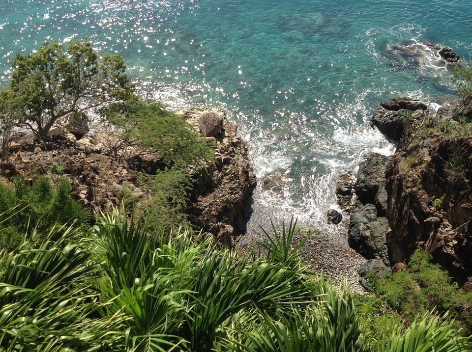 The private "Honeymoon Beach" below the Pebble Cove deck.