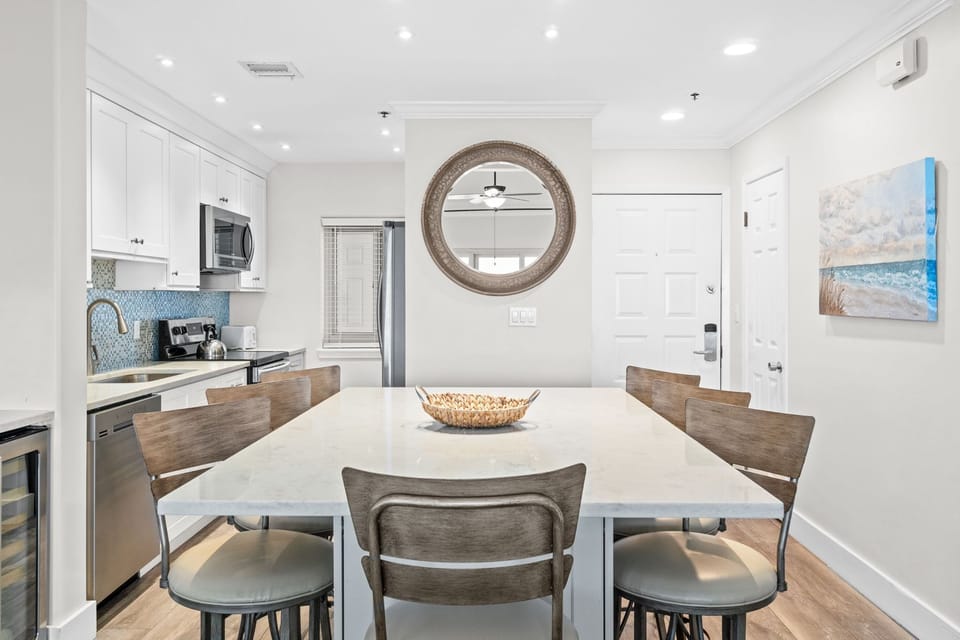 The large island serves as a dining area or just breakfast bar. Seats 7.