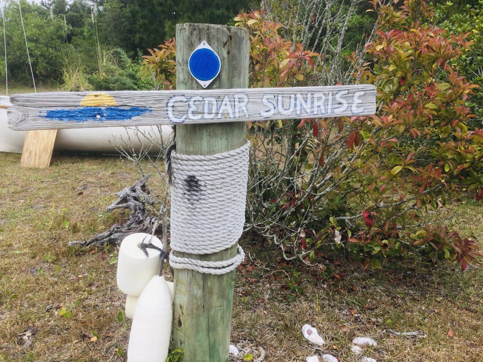 Sign is near the road at the entrance to the driveway.