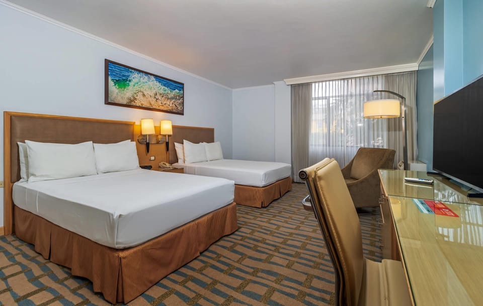 Room, 2 Queen Beds, Non Smoking | Minibar, in-room safe, desk, laptop workspace