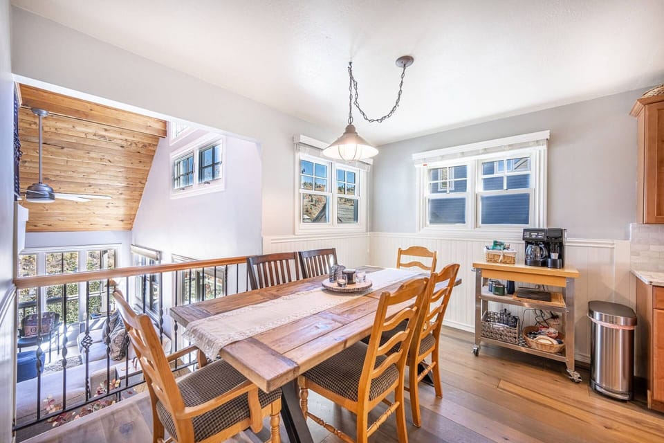 Adjacent to the Kitchen is the comfortable dining area featuring new hardwood flooring, and a stocked coffee bar.