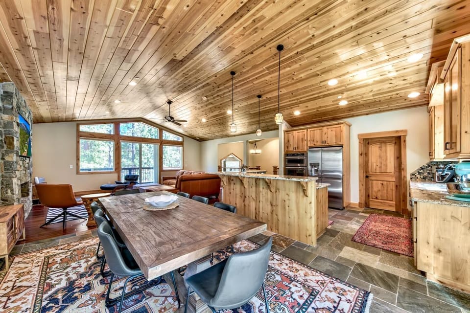 Gather around this stunning wood-beamed dining space where your mountain retreat memories are made over shared meals.