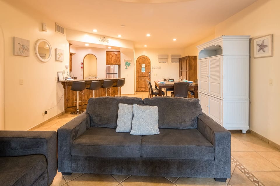 The living room flows seamlessly into the kitchen and dining areas, perfect for entertaining.