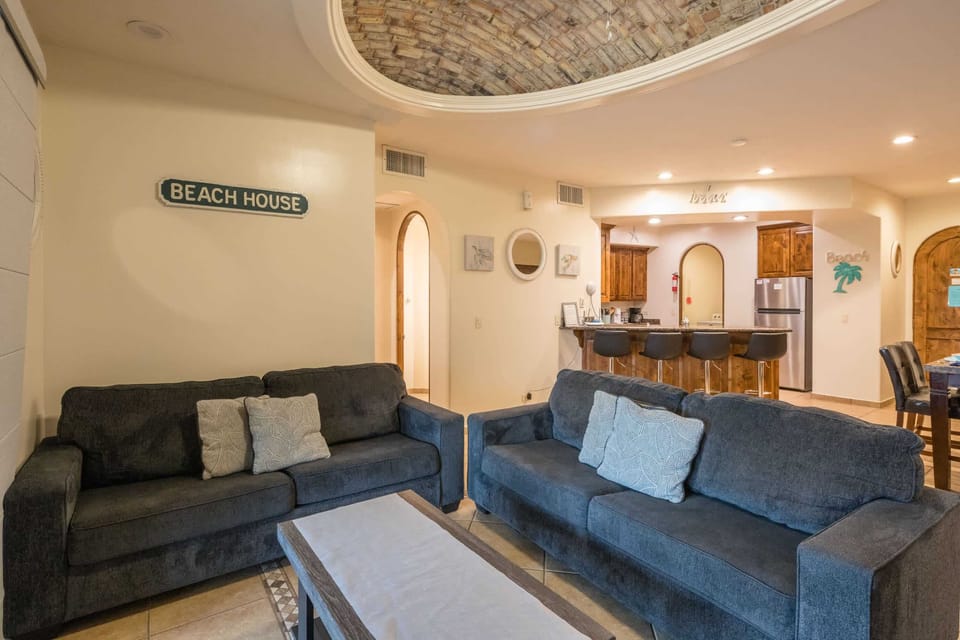 Large sectional sofa offers plenty of space to gather and unwind after a day at the beach.