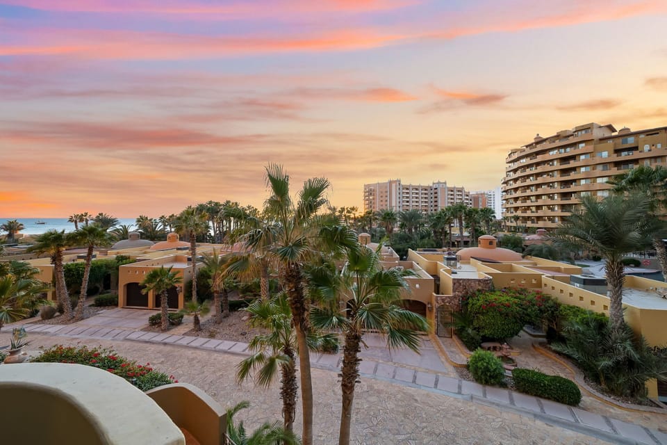 Evening views from your balcony lush palms, desert architecture, and glowing sunsets over the Sea of Cortez.