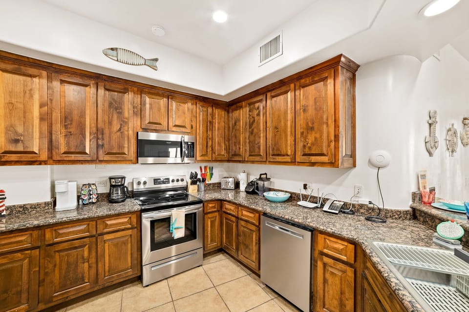 Everything you need—full-size fridge, oven, microwave, dishwasher, coffee maker, and ample counter space.