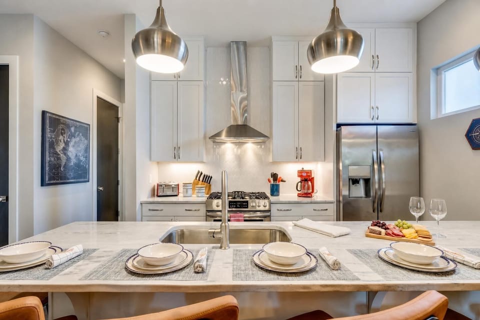 Cook for a crowd in this kitchen with a large island, gas grill access just outside, and enough counter space that everyone gets a job and nobody's in the way
